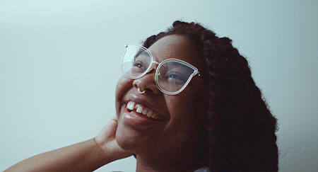 Close-up of cheerful girl wearing eyeglasses