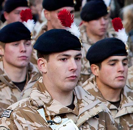 Private Lee Rigby (C), a drummer in the the Royal Regiment of Fusiliers, taking part in a march through Hounslow, London