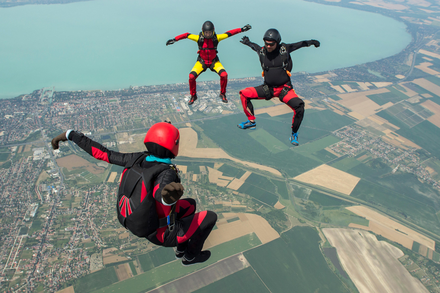 Three skydivers free flying in formation, Siofok, Somogy, Hungary