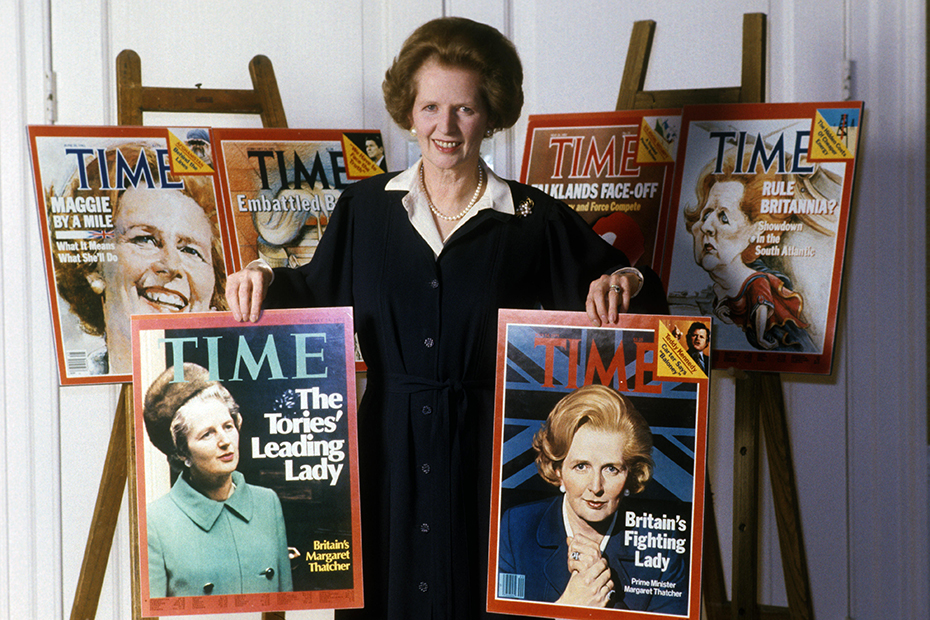 Prime Minister Margaret Thatcher posing with the six editions of Time magazine in which she appeared on the front page cover.