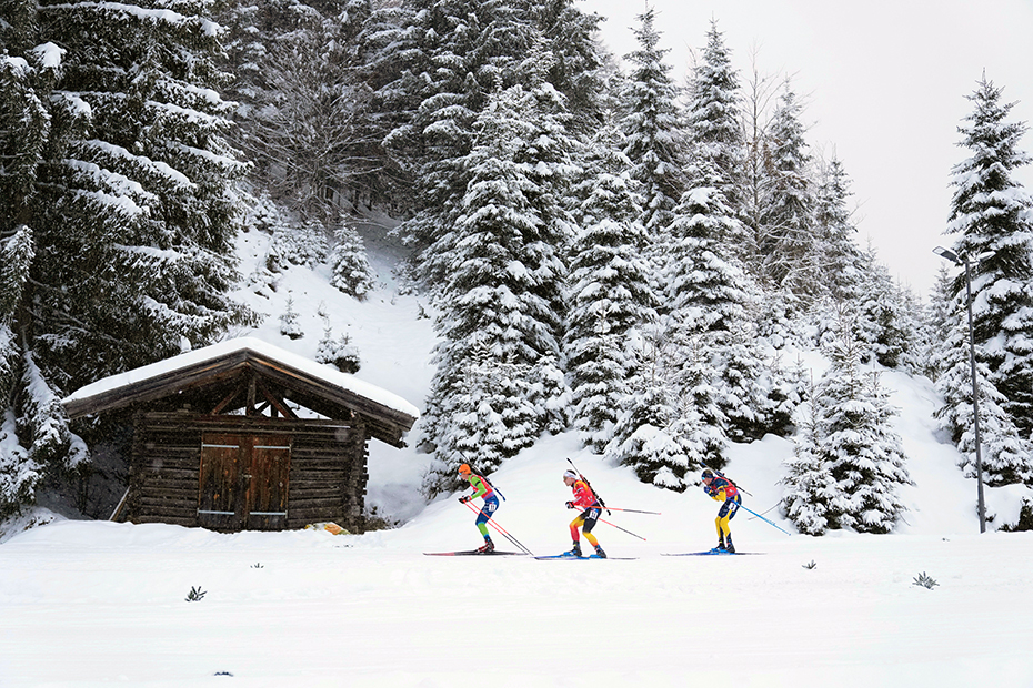 Slovenia's Miha Dovzan, Belgium's Thierry Langer and Sweden's Viktor Brandt during the relay event at the Biathlon World Cup in Hochfilzen, Austria.