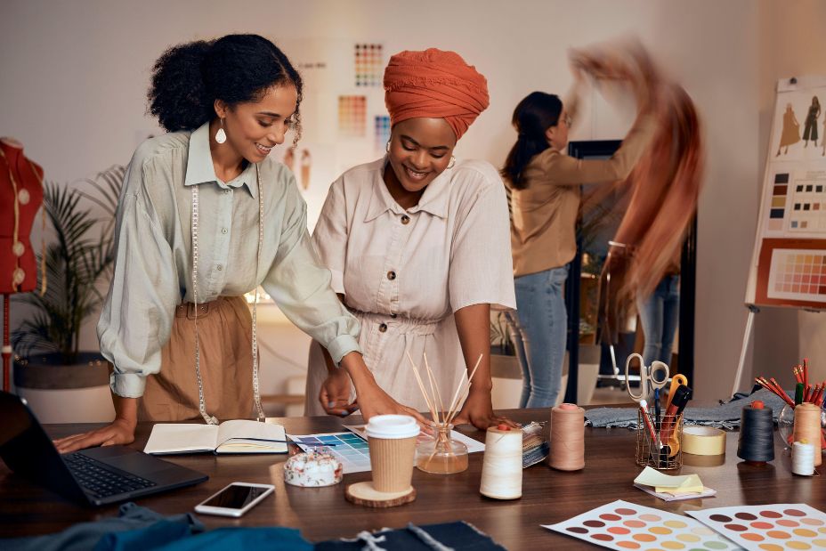 Designer, team creative collaboration and fashion designers working in studio for brainstorming, planning design and business people teamwork - Image ID: 2M0MGR7 (RF)