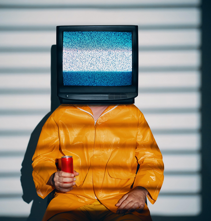 Surreal art of TV addicted man with television instead of head