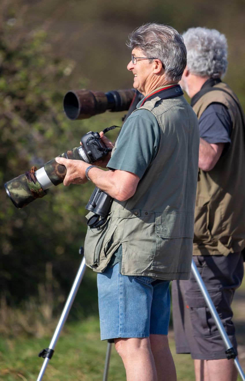 Portsmouth Hampshire, UK Two photographers with cameras photographing wildlife.