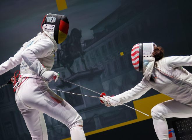 Anne Sauer of Germany (R) and Lee Kiefer of United States (R) in action during the women's semi-final of Fencing Grand Prix 