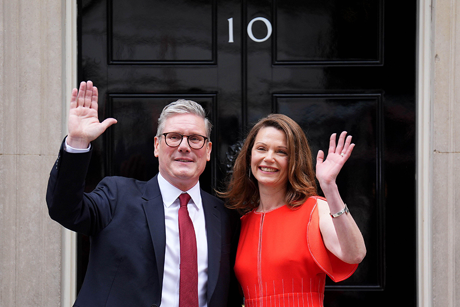 Newly elected Prime Minister Sir Keir Starmer and his wife Victoria Starmer arrive at his official London residence at No 10 Downing Street for the first time after the Labour party won a landslide victory at the 2024 General Election.