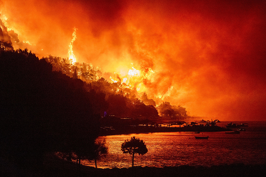 A wildfire approaches a beach on the Adriatic coast near Omis, southern Croatia