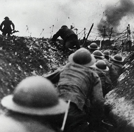THE SOMME, FRANCE - July 1916 - British soldiers go 'over the top' from a trench during the Battle of the Somme during the First World War. The Battle