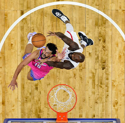 Washington Wizards' Anthony Gill, left, and Philadelphia 76ers' Dewayne Dedmon reach for a rebound during the second half of an NBA basketball game, Sunday, March 12, 2023, in Philadelphia.