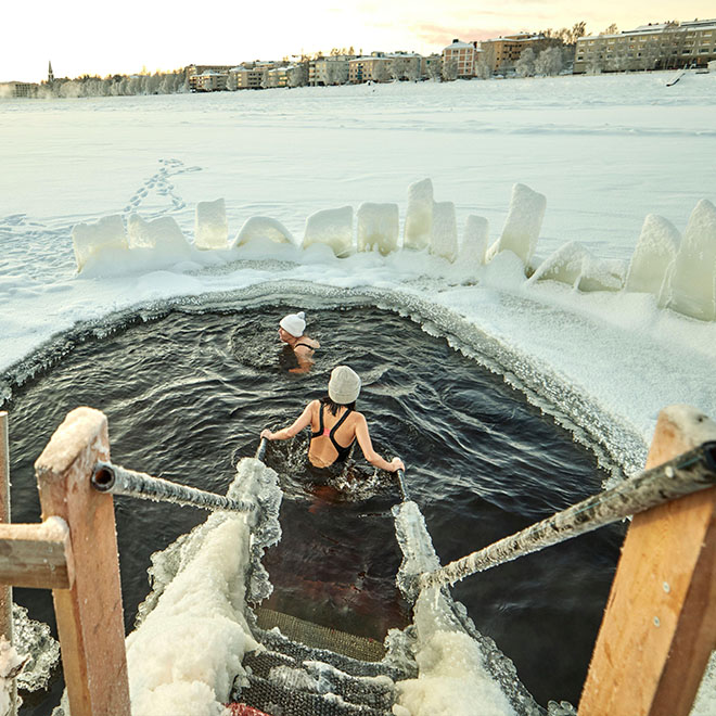 Rovaniemi, Lapland, northern Finland. frozen Kemijoki river hole in the ice for swimming 