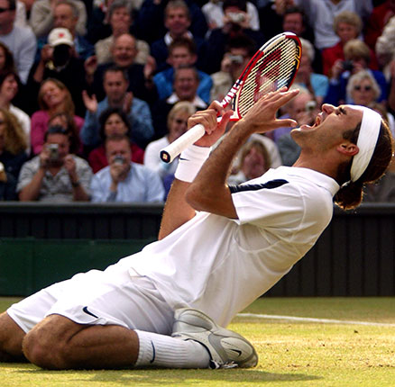 Tennis - Wimbledon 2004 - Men's Final - Roger Federer v Andy Roddick. Roger Federer celebrates winning Wimbledon 2004 after beating Andy Roddick