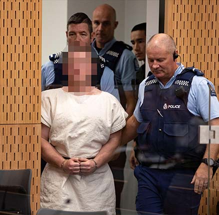 Brenton Tarrant, charged for murder in relation to the mosque attacks, is lead into the dock for his appearance in the Christchurch District Court, New Zealand March 16, 2019.