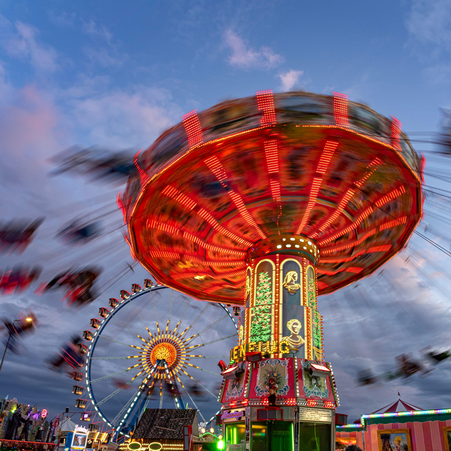 Swing carousel at Oktoberfest 2024 at dusk, Munich, Bavaria, Germany