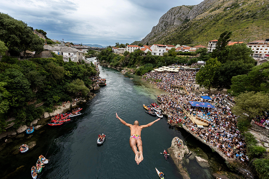 A participant dives from historical 'Old Bridge', also known as 'Mostar Bridge' during the traditional diving competition event