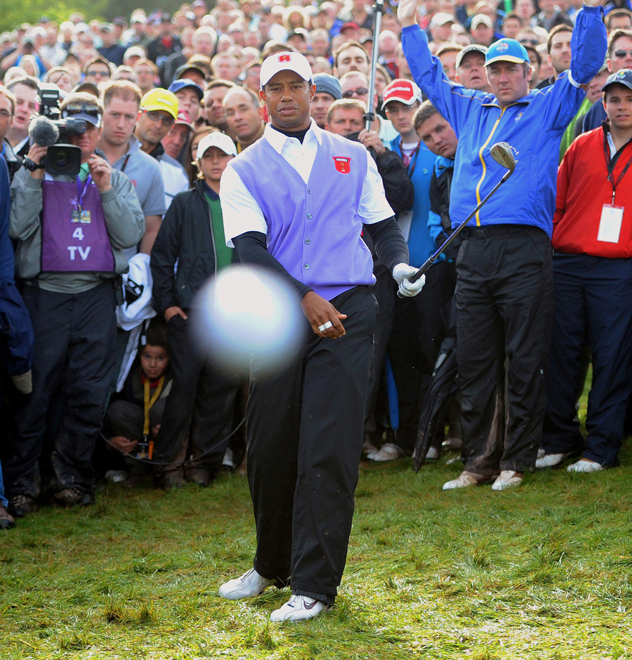TIGER WOODS HITS PHOTOGRAPHER MARK PAIN WITH HIS BALL. THE 2010 RYDER CUP, CELTIC MANOR, WALES. 2/10/2010