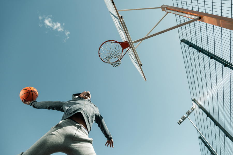 Low angle view of a basketball player jumping