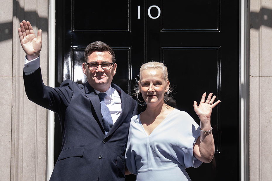 New Prime Minister Andy Burnham with his wife Marie-France van Heel outside 10 Downing Street