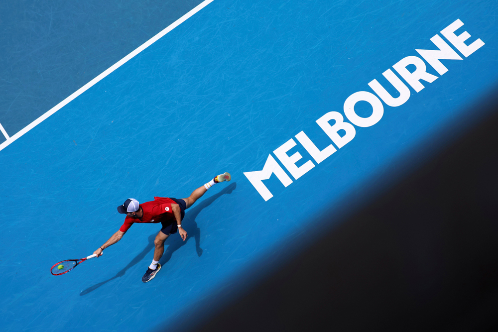 Tommy Paul of the U.S. plays a backhand return to Miomir Kecmanovic of Serbia during their third round match at the Australian Open tennis championships at Melbourne Park, Melbourne, Australia, Saturday, Jan. 20, 2024