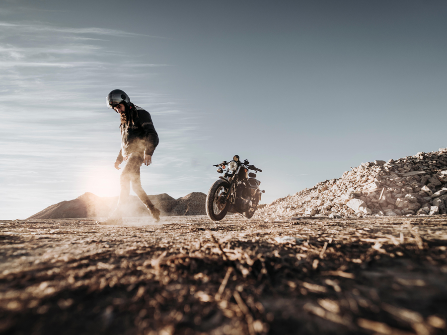Man with motorbike in nature