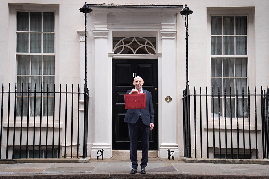 Chancellor of the Exchequer John Healey poses for photographs as he leaves 11 Downing Street, London, before delivering his first Budget to the Houses of Parliament.