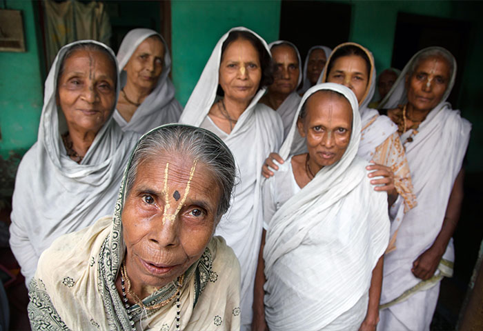 Indian Hindu widows living in communities in ashrams in Vrindavan , India