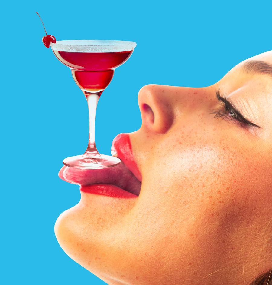 Woman balancing cherry cocktail glass on tongue with bold blue background