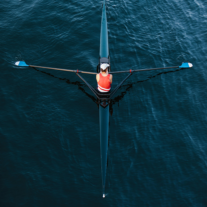 View from above of single scull crew racer, Lake Union, Seattle, Washington, USA.