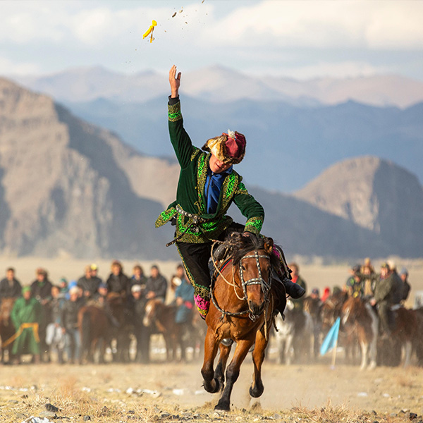 bayan Ulgii, Mongolia, 3rd October 2015: kazakh men on their horses in a landscape of western mongolia 