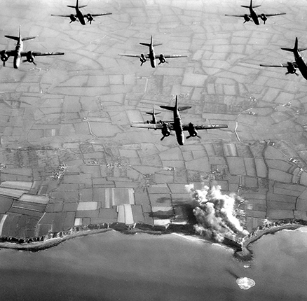 D-Day WW2 pre-invasion aerial June 1944 pinpoint bombing of Pointe du Hoc Normandy Northern France, image of USAF Ninth Air Force B26 bombers bombing Nazi fortifications prior to D-Day Invasion