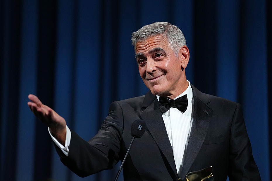 George Clooney addresses the audience after receiving the golden lion for lifetime achievement during the opening ceremony of the 83rd edition of the Venice Film Festival in Venice, Italy.