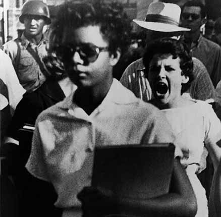 Elizabeth Eckford, one of the nine African American students enrolled in Little Rock Central High is harassed on the first day