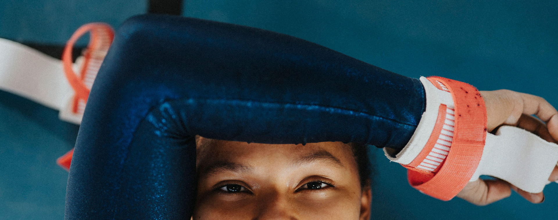 Directly above portrait of female athlete resting on floor