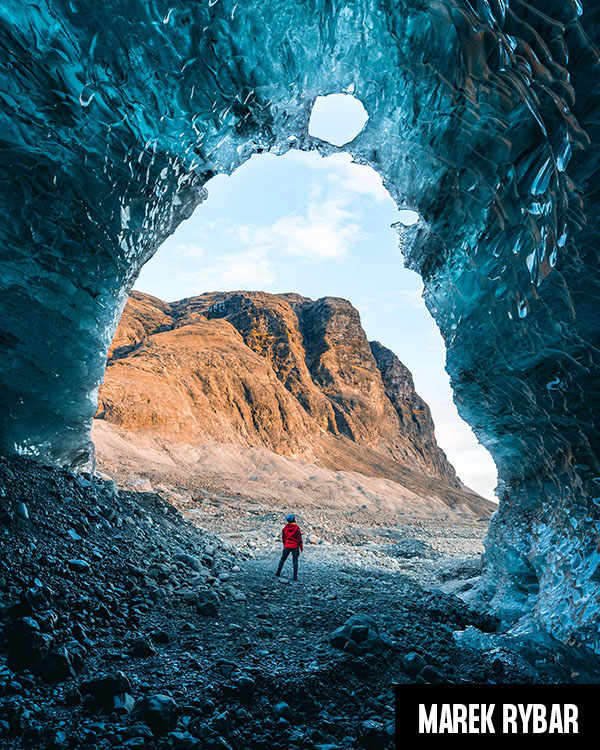 Solo female adventure traveler is discovering the ice caves in Iceland at Vatnajokull Glacier near to Jokulsarlon Glacier Lagoon. Tourism in abandoned