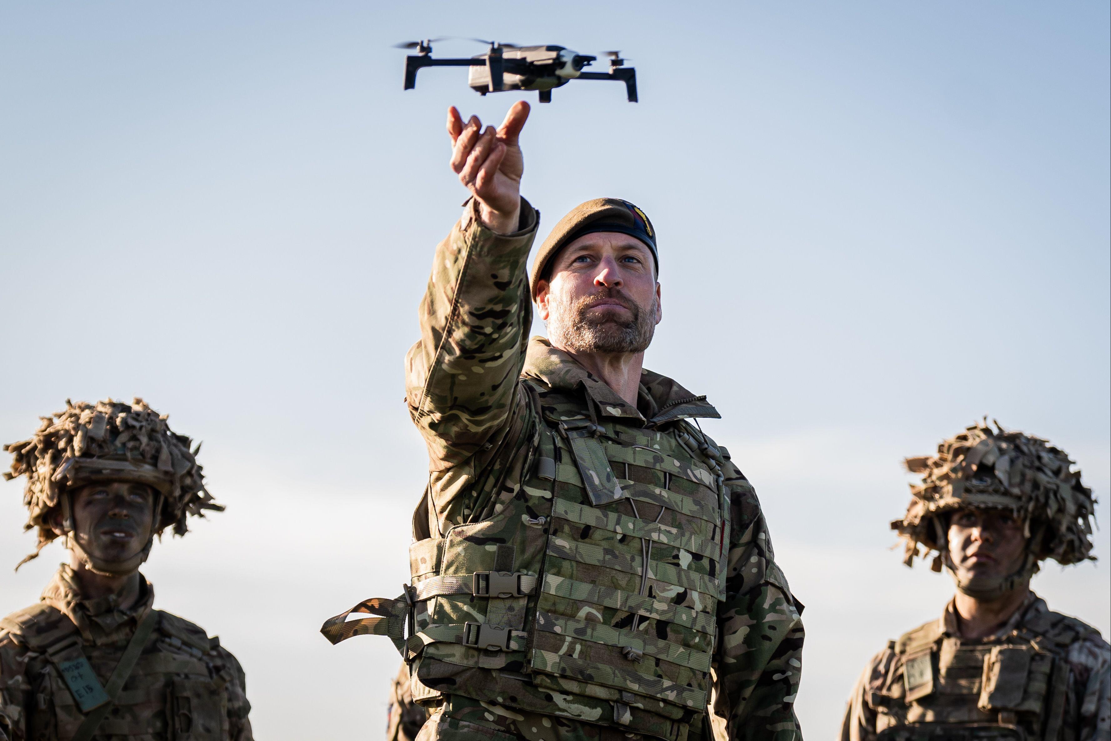 Prince of Wales, Colonel of the Welsh Guards, launching a drone, during a visit to the 1st Battalion Welsh Guards at Salisbury Plain, Wiltshire, November 26, 2024