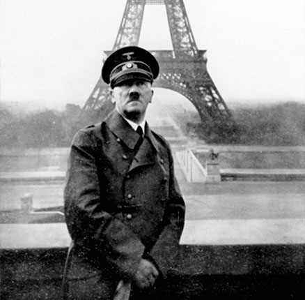 The image from the Nazi Propaganda! shows Adolf Hitler in front of the Eiffel Tower in Paris, France, which was occupied by German troops, on 28 June 1940.