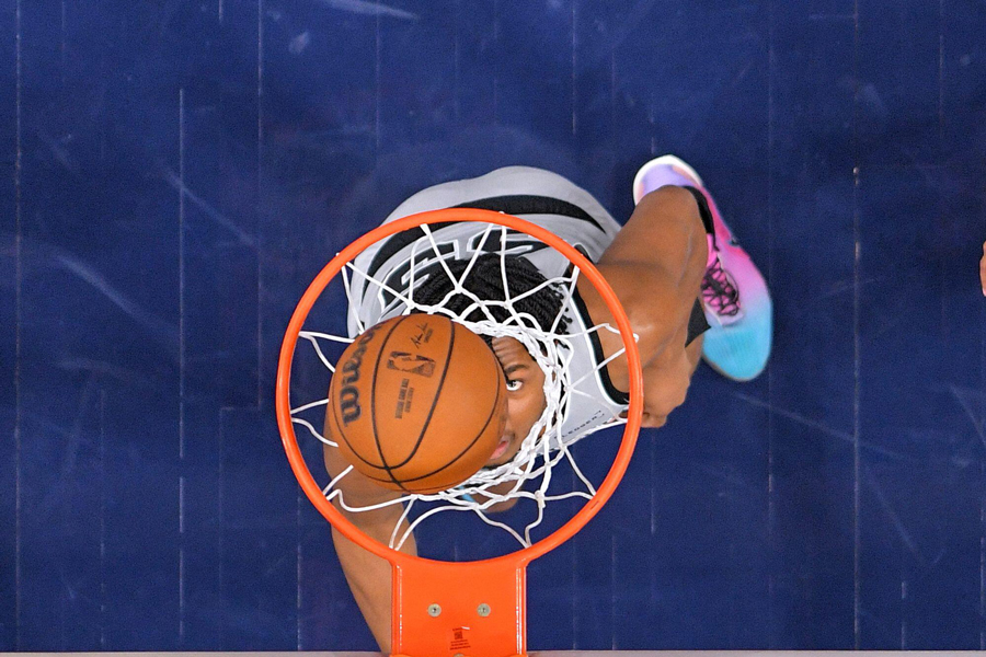 San Antonio Spurs forward Harrison Ingram watches the ball go in as the Spurs score during the second half of an NBA basketball game against the Los Angeles Clippers, Thursday, April 2, 2026, in Inglewood, Calif.