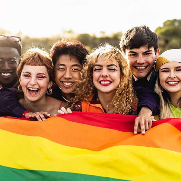 Diverse young friends celebrating gay pride festival - LGBTQ community concept 